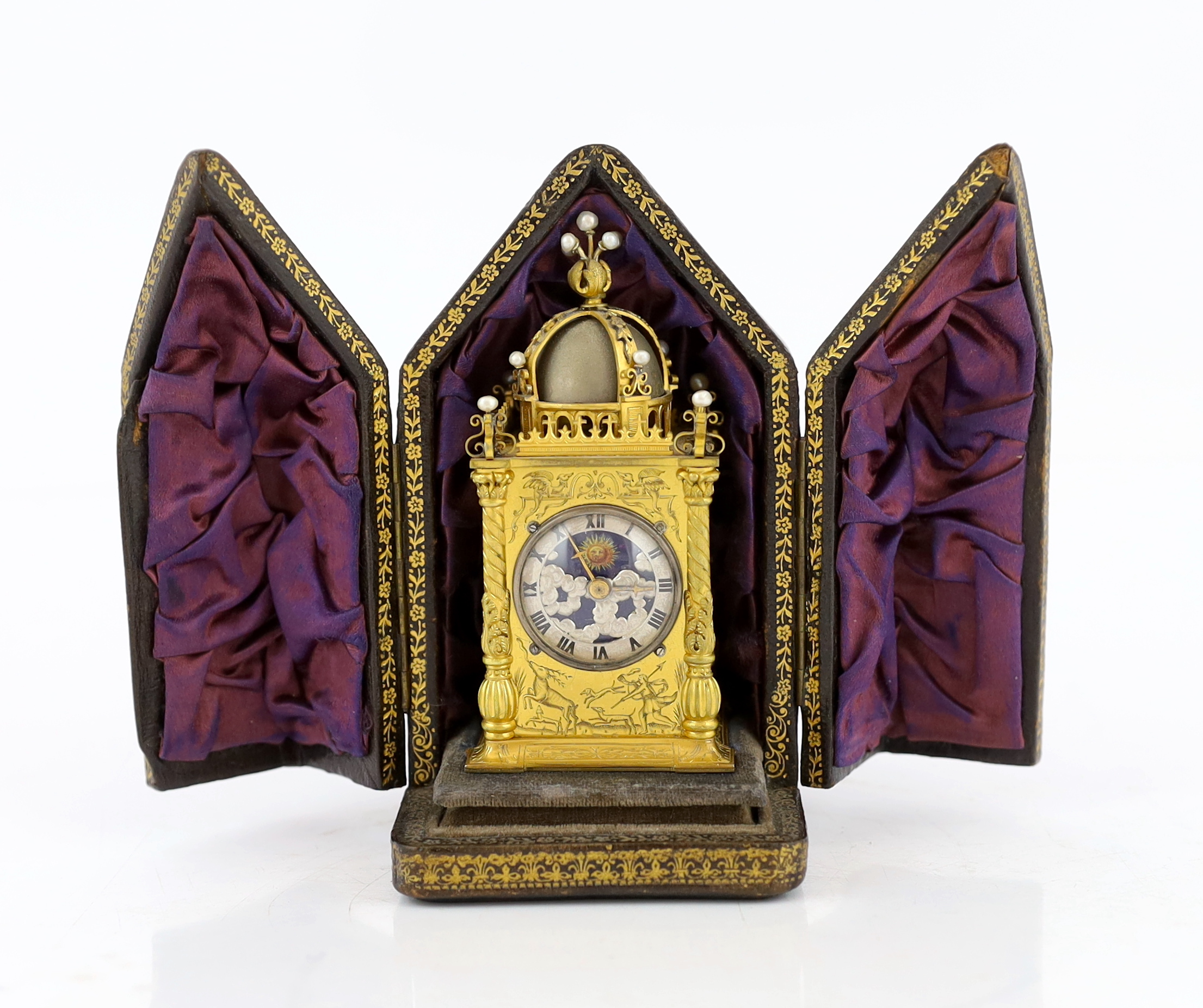 An early 20th century French miniature timepiece modelled on a 17th century domed bell clock, 4.75cm wide, 9.5cm high, with original leather travelling case